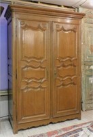 Early 19th Century French Carved Oak Armoire.