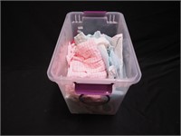 Container of children's clothing, infant to