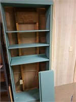 Adjustable painted wooden bookshelf. Basement back