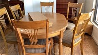 66x44 oval oak laminate table and 6 chairs, has