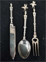 Antique silver serving utensils