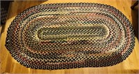 Oval antique braided rug carpet, measures 68