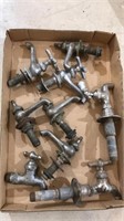 Box of old 6 faucets and 3 spigots