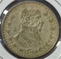 Silver 1957 un peso Mexican dollar coin