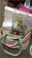 Large canvas bag filled with pink and green table