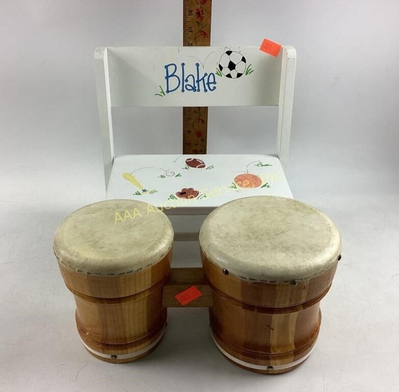 Toy wood bongo drums.  Child’s white flip stool