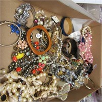 Flat of costume jewelry.