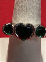 Green CZ ring with three stones. Center stone is