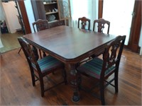 1920s 58 by 40 inch wooden dining table with 5