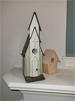 Two wooden bird houses. Tallest is 12"