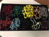 SELECTION OF TEN COLORFUL BEADED NECKLACES