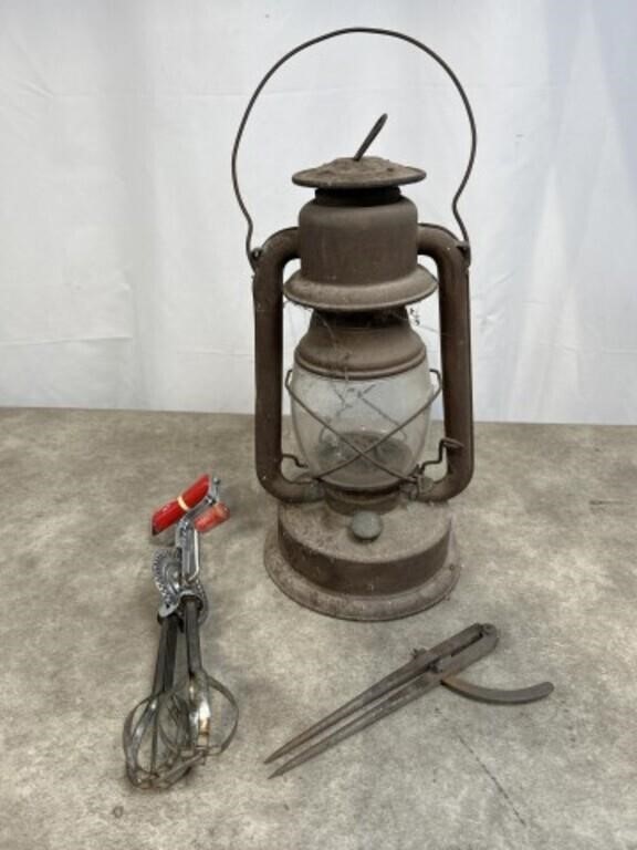 Vintage lantern, whisker, and metal drafting tool