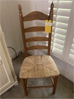 Four ladder back chairs with rush bottom seats