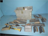 Tub of assorted trowels