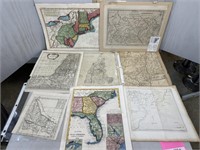 Assorted unframed maps including New England,