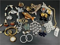 Vintage jewelry lot including rings, fishes, more