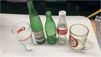 Antique pop bottles & glasses.