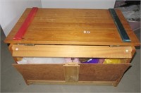 Toy chest filled with various child dress up