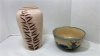 Ceramic pink Vase with Leaf design on it.