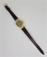 Gold Tone Lizard Skin Movado Wrist Watch.