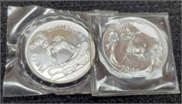 (2) Different 1 Troy Oz Silver Christmas Rounds
