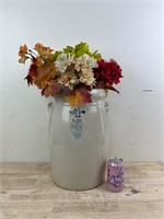 Large ceramic vase with artificial flowers
