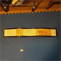 Movie reel tin sign