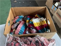 Banana box full of NOS scarves and hats