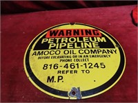 Porcelain Amoco pipeline marker sign.