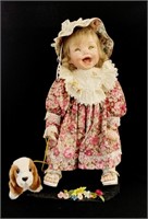 Giggling porcelain collector doll with floral dres