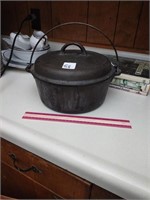Cast iron no. 8 dutch oven with lid and handle. 5
