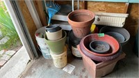 Plastic and a few terra-cotta planters, small