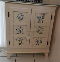 White painted floral two door cabinet