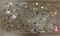 Bag of miscellaneous earrings and charms. Some
