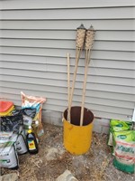 Metal Barrel and Tiki Torches