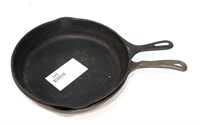 2- Large cast iron pans, 1 is a Wagner