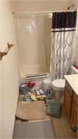 Bathroom supplies including shower curtain, mat