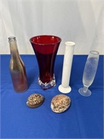 Assortment of glass vases and seashells