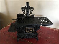 rare cast crescent stove with pieces