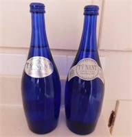 Cobalt blue bottle of sparkling Ty Nant imported