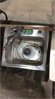 Stainless steel single sink w/ faucet & sprayer.