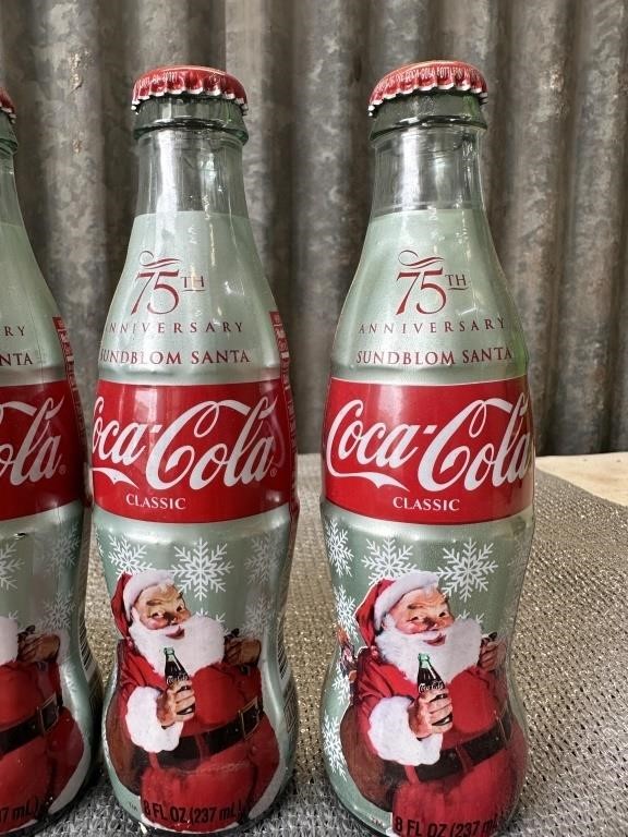 4 Coke collector bottles