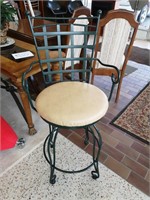 Beautiful heavy wrought iron swivel bar chair.