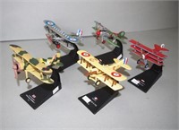 Five various Amer Die Cast model planes on stands