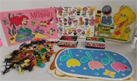 Various placemats, small toys, insects