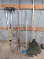 30 gal trash can, w/yard tools, pitch fork