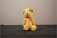 Antique Teddy Bear with Faded Red Bow