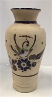 Tall pottery vase measuring 13 1/2 inches tall.