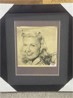 Doris Day signed newspaper photo, tear at top as s