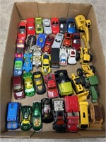 Toys cars and trucks, most are Hot Wheels